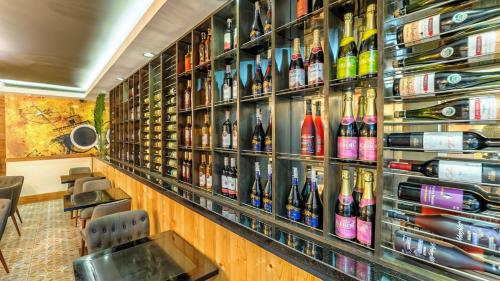 a room filled with lots of bottles of wine at Sweet Home Boutique Hotel in Tagbilaran City