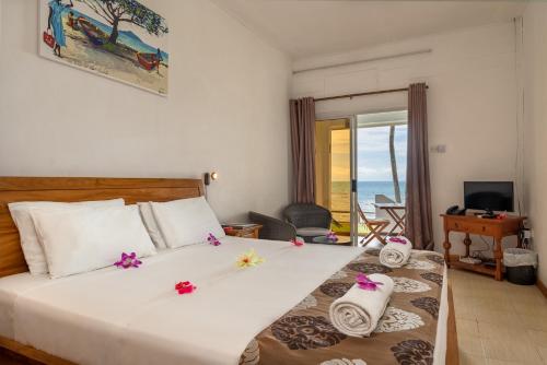 Postel nebo postele na pokoji v ubytování Beach Cove