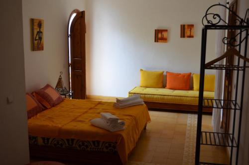 Säng eller sängar i ett rum på Casa Naima