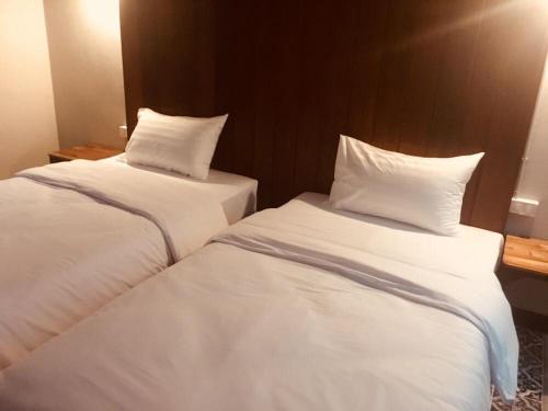 Кровать или кровати в номере Thaimueang Boutique Hotel