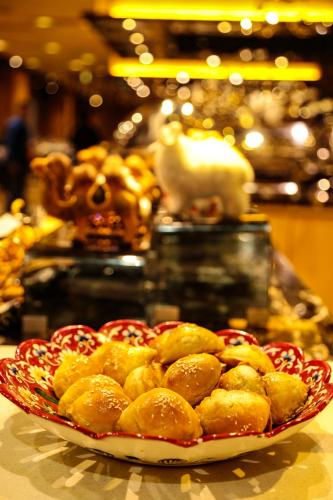 a plate of food on top of a table at JinJiang International Hotel Urumqi in Ürümqi