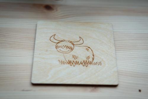 a drawing of a cow on a napkin on a table at Lochanside in Struan