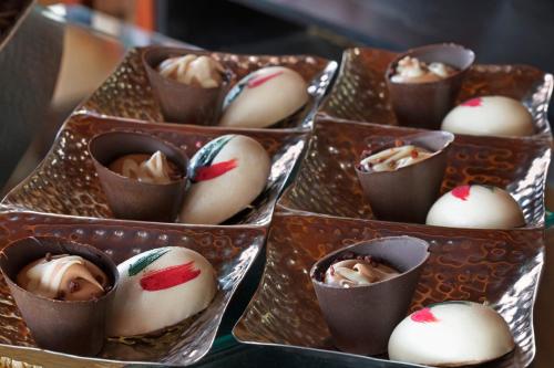 a group of chocolate cups filled with candy canes at Orchid Eilat Hotel in Eilat