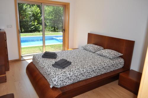 Casa da Quinta do Sóto tesisinde bir odada yatak veya yataklar