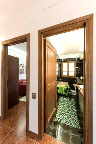 an open door in a room with a kitchen at Casa Ermo Colle in Sant'Ermo