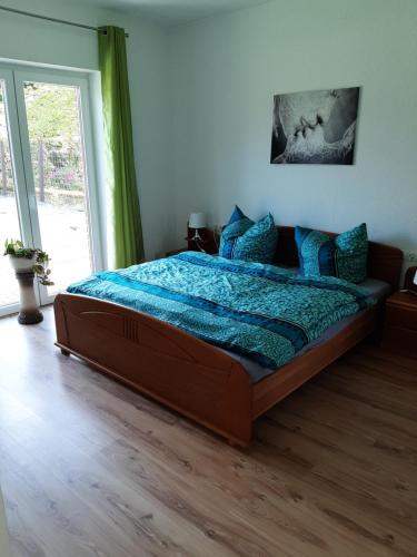 Säng eller sängar i ett rum på Ferienwohnung Uhlenbusch Paradise