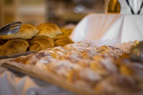 a bunch of pastries on a tray on a table at Bull Reina Isabel & SPA in Las Palmas de Gran Canaria