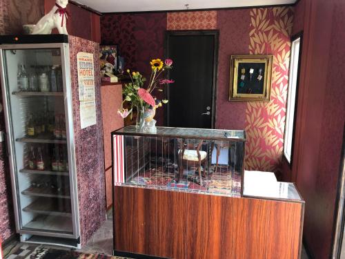 a bird cage with flowers in it in a room at Grand Circus Hotel in Malmö