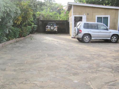 a white van parked in front of a house at JoysVilla Family Holiday Home in Malindi