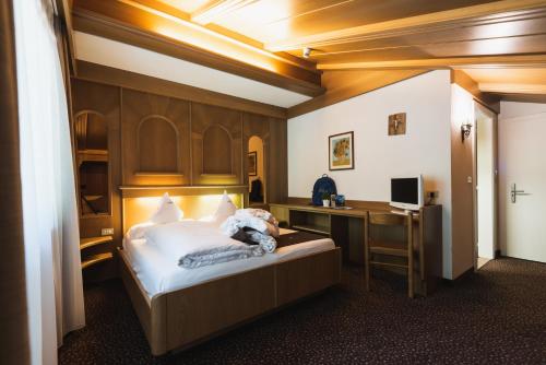 Postel nebo postele na pokoji v ubytování Hotel Catinaccio