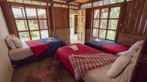 Кровать или кровати в номере Hostal El Nawal