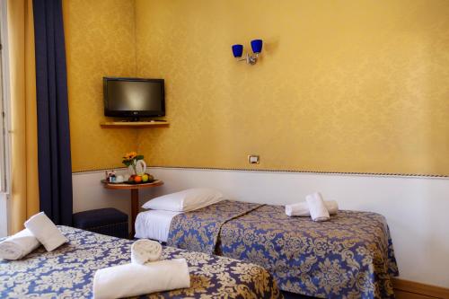 Uma cama ou camas num quarto em iH Hotels Piazza di Spagna View - Luxury Guest House