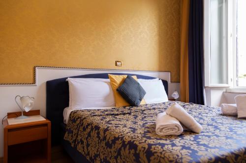 Letto o letti in una camera di iH Hotels Piazza di Spagna View - Luxury Guest House