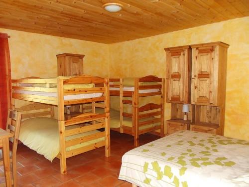 Un pat sau paturi într-o cameră la L'Asphodèle