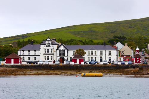 a large building on the shore of a body of water at Royal Valentia Hotel in Valentia Island