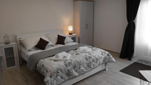 a bedroom with a bed with two people on it at Huncovská 14 in Košice