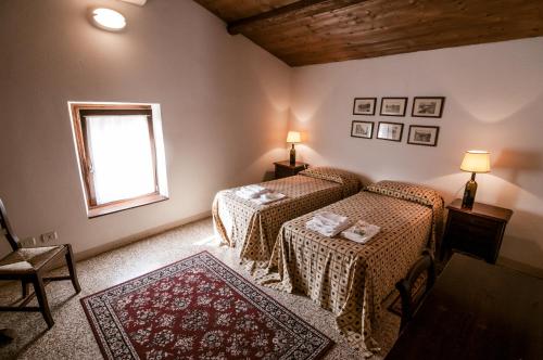 Postel nebo postele na pokoji v ubytování Corte Spinosa