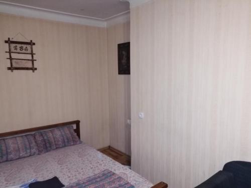 a bedroom with a bed in a room at Пастера in Dnipro