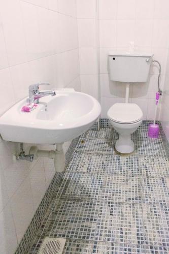 a bathroom with a sink and a toilet at Meliva Guest House Mbarara in Mbarara