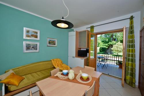 a living room with a couch and a table at Residence Verde Quiete in Sarnano