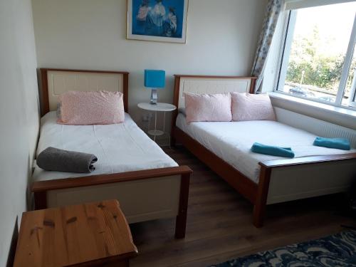 Cama o camas de una habitación en Tisara Guest House