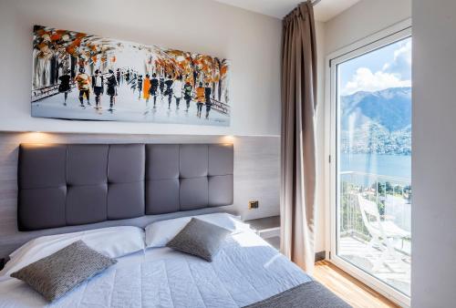 Postel nebo postele na pokoji v ubytování Hotel Asnigo