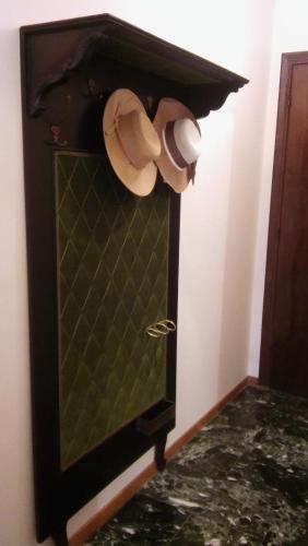 a cabinet with two cups and a hat in a room at CHRYSSA - ΧΡΥΣΑ in Patra