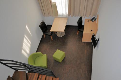 an overhead view of a room with desks and chairs at Apart2stay in Luxembourg
