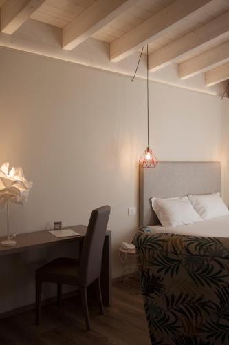 Postel nebo postele na pokoji v ubytování Hotel Berta