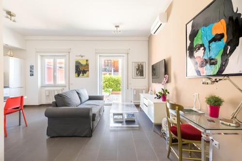 a living room with a couch and a table at Galeria Home Apartments in Anguillara Sabazia