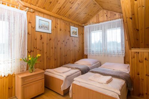 En eller flere senge i et værelse på Gościniec Basia