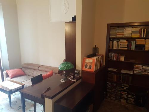a living room with a couch and a table at Casa Brunello in La Spezia