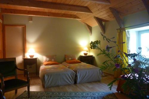 Кровать или кровати в номере Bastides Du Mezenc