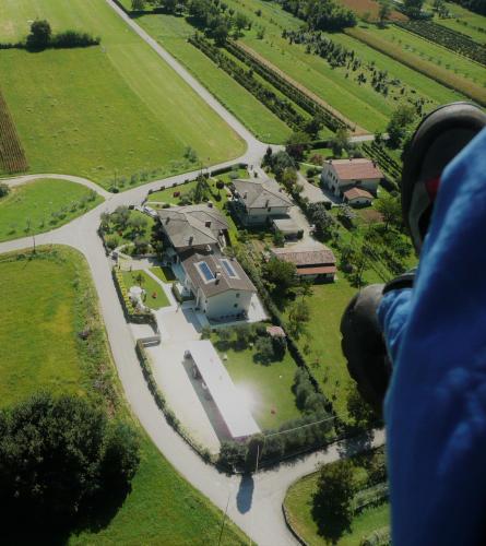a person is looking down at a large house at Residence Gonda&Giuliano in Borso del Grappa