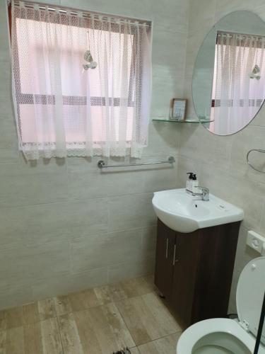 Ванна кімната в Dilisca Guesthouse
