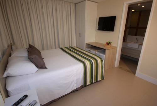 Cama ou camas em um quarto em Namoa Pousada