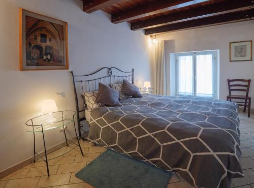 a bedroom with a bed and two glass tables at Casa Snomata in Senigallia