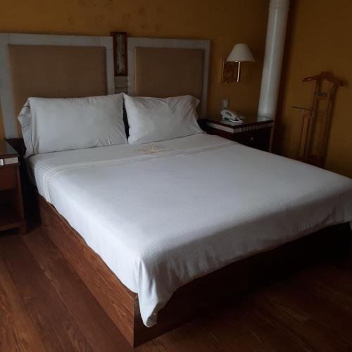 Ένα ή περισσότερα κρεβάτια σε δωμάτιο στο Villas Princess Hotel