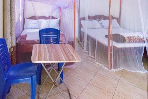 Voodi või voodid majutusasutuse Silver Motel Mbarara toas