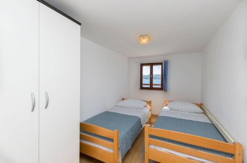Postel nebo postele na pokoji v ubytování Apartment Island Dream