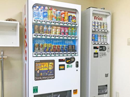 a vending machine filled with drinks and soda at Marine Lodge Marea Ishigaki in Ishigaki Island