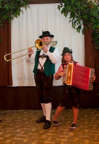 a man playing a trumpet and a woman playing an accordion at Gasthof Koglerhof in Ternberg