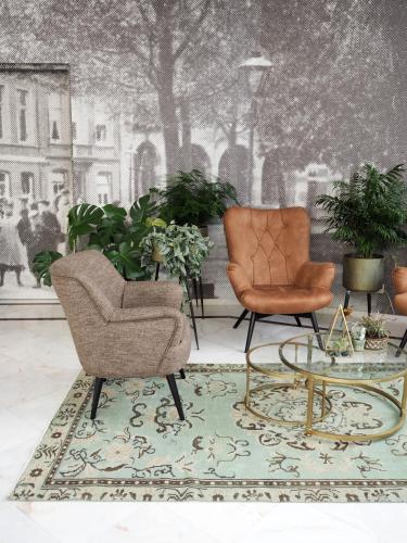 a living room with two chairs and a table at Hotel Sebel in The Hague