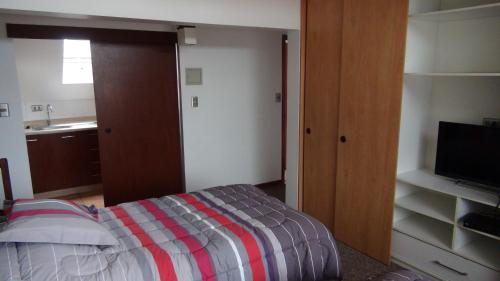 Ένα ή περισσότερα κρεβάτια σε δωμάτιο στο Hostal Los Avellanos