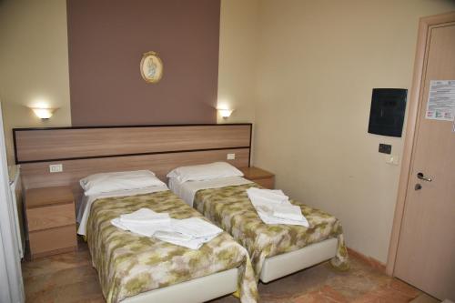 Hotel Neltonにあるベッド