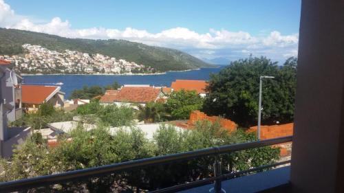 a view of a city and a lake from a balcony at Apartmani Mia in Trogir