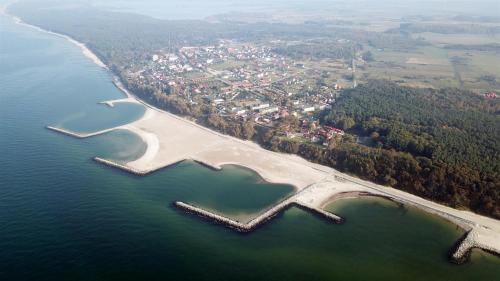 an aerial view of a island in the water at Albatros Spa & Ski in Jarosławiec