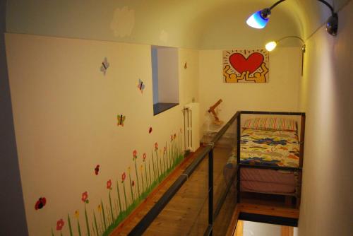 a childs room with a crib and a bedroom at LOFT 51 in Pescara