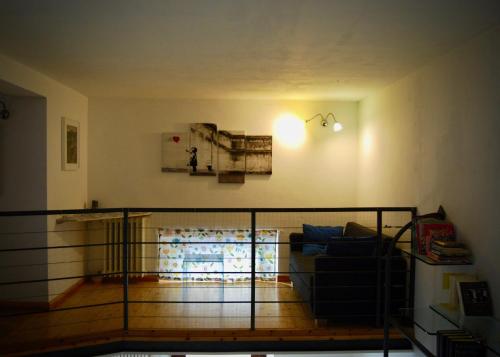 a living room with a couch and a balcony at LOFT 51 in Pescara
