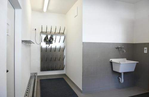 a bathroom with a sink and a toilet in it at Ferienwohnungen Marmot in Kappl
